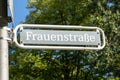 Sign with german text frauenstraÃÅ¸e, in english woman street